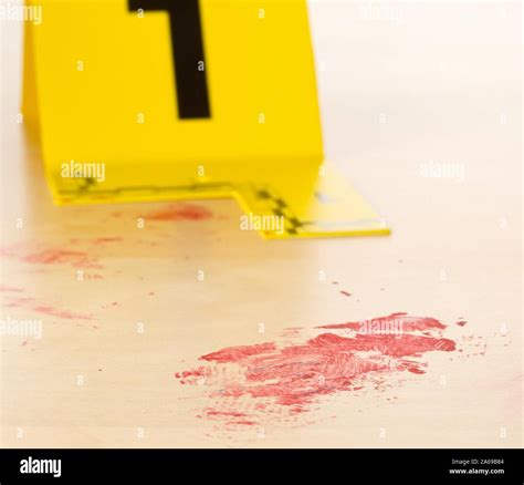 Crime Scene Investigation Csi Evidence Marker With Blood Spot On Wooden