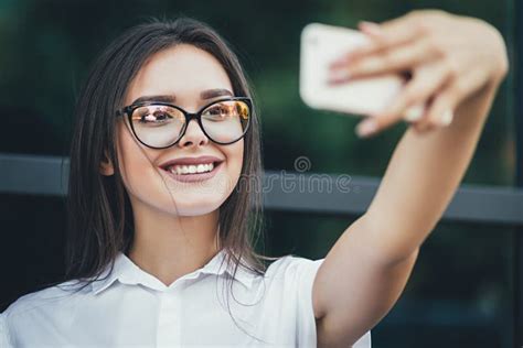 Beautiful Brunette Business Woman Photographing Selfie On A Phone In