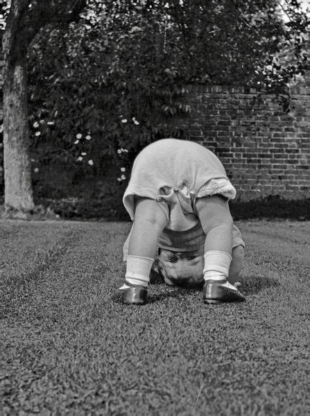 Toddler Bending Over In A Garden Date Circa 1920s Print 14225128