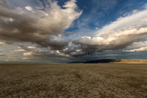 Big Puffy Clouds Over A Parched Desert Stock Photo Image Of