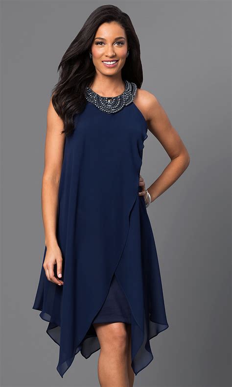 With unique design details, we suggest clean and simple. Sangria Navy-Blue Handkerchief Dress - PromGirl