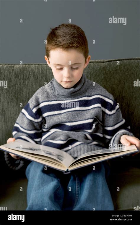 Boy Reading Book Stock Photo Alamy