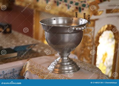 Silver Vessel With Holy Water On Stand In Church Baptism Ceremony