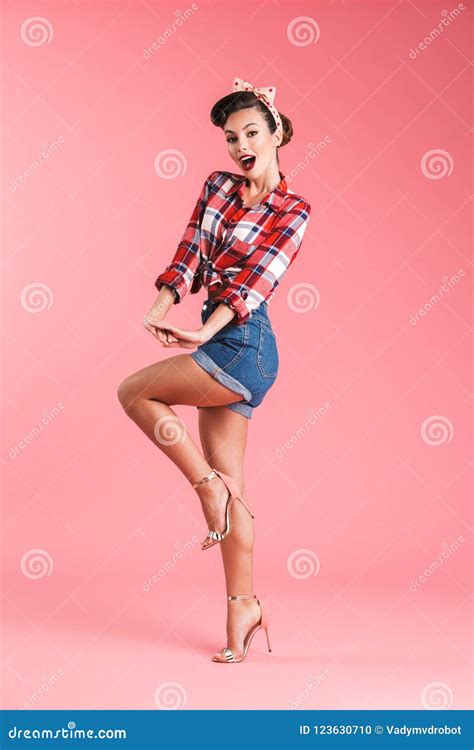 Full Length Portrait Of A Cheerful Brunette Pin Up Girl Stock Photo