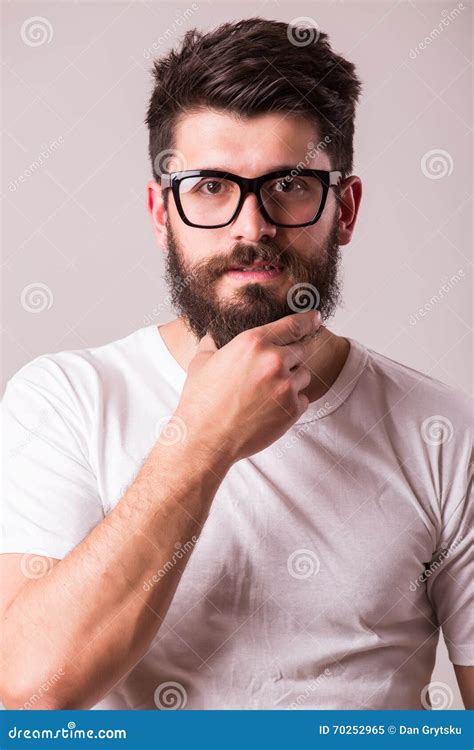Face Portrait Of Bearded Man In Glasses With Hand On Beard Stock Image Image Of Food Grey