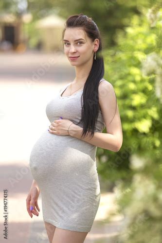 Cute Young Brunette Sexy Pregnant Woman With Long Hair In Ponytail And