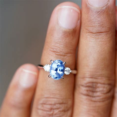Vivid Medium Blue Oval Sapphire Diamond Platinum Trilogy Engagement Ri