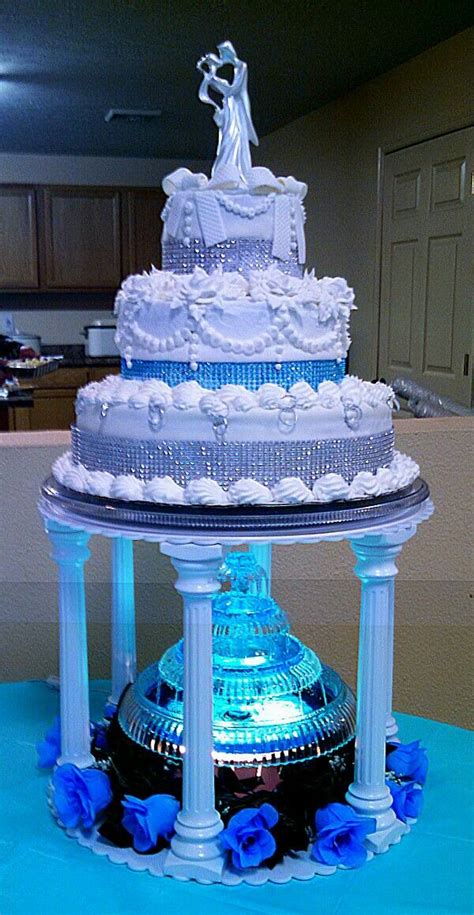 Three Tiered Silver And Teal Aqua Blue Wedding Cake With Lighted