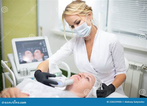 A Woman In A Cosmetology Office Receives A Smas Lifting Procedure Non