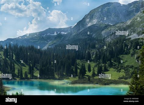 Amazing Alpine Scenery With Vivid Turquoise Colored Lake In Foreground