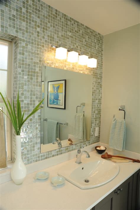 The standard height for vanity lighting above bathroom mirrors is 75 to 80 from the finished floor to the center of the light fixture. Placement of Light above mirror