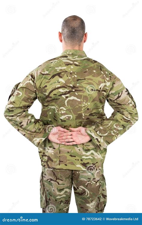 Rear View Od Soldier Standing With His Hands Behind Back Stock Photo