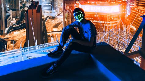 Mask Man Sitting On Top Of Building Hd Photography 4k