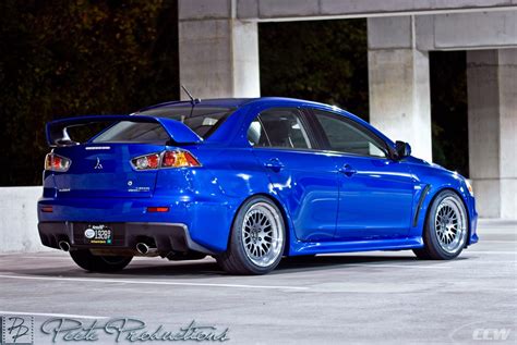 There is a small dent is the lower front passenger side bumper. Blue Mitsubishi EVO X - CCW Classic Gunmetal Forged Wheels ...