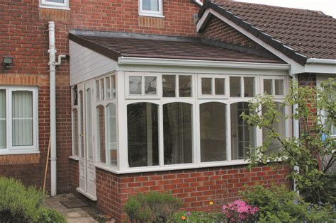 A Small Lean To Conservatory Roof Which Is Neatly Matched To The