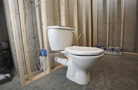 A Saniflo Upflush Toilet System Installed In A Basement Bathroom