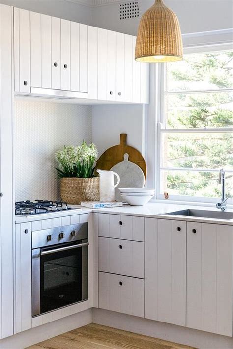 For the modern and minimalist kitchen, the beadboard chosen should have a clean look like in the picture below. Kitchen with Beadboard Cabinets - Cottage - Kitchen