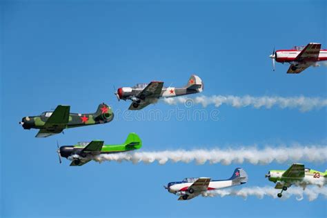 A Group Of Yak 52 Aircraft In The Sky Performs The Program At Th