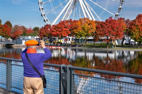 View Of The Old Port Of Montreal And Montreal Ferris Wheel In Autumn Editorial Stock Image