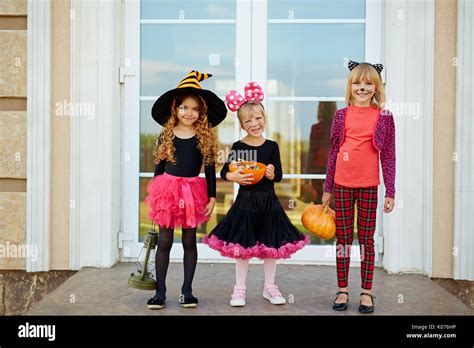 Trick Or Treaters By Door Stock Photo Alamy