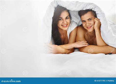 man and woman in bed stock image image of happiness 61077795