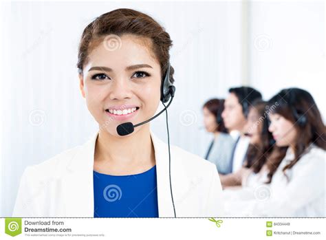 Smiling Asian Woman With Headphone As A Telemarketer Operator Call Center And Customer Service