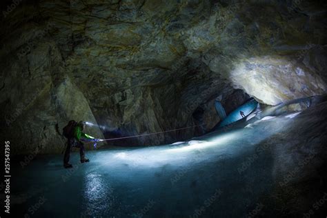Two Men Climbing While Exploring Cave Of Booming Ice Chasm Crowsnest