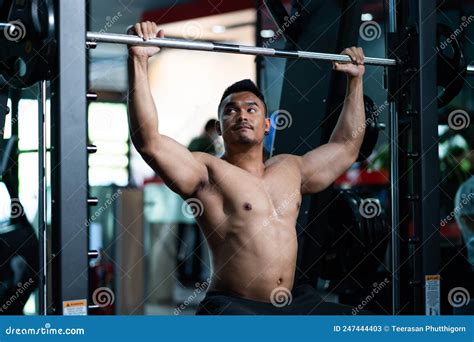 Shirtless Adult Asian Men Sweating While Lift Up The Barbell Workout