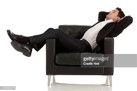 Person Sleeping In Chair Photos And Premium High Res Pictures Getty