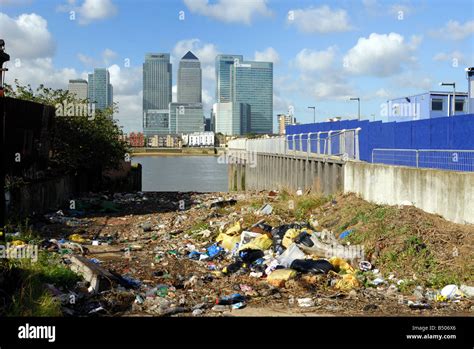 River Thames Pollution With Canary Wharf In Background London Uk Stock