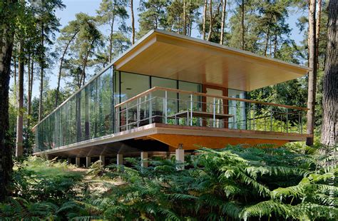 A Modern Forest House Built From Glass Iron And Wood Structure In