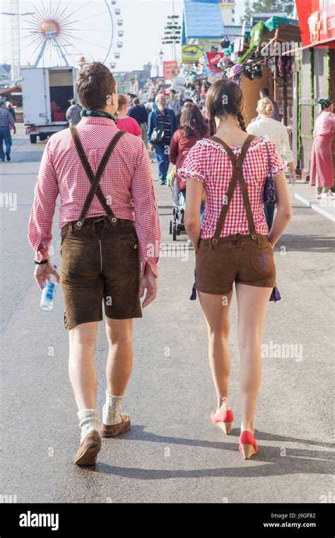 Germany Bavaria Munich Oktoberfest Couple Dressed In Lederhosen