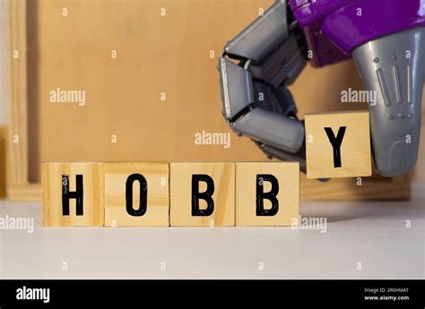 The Word Hobby Consists Of Wooden Cubes With Letters Top View On A