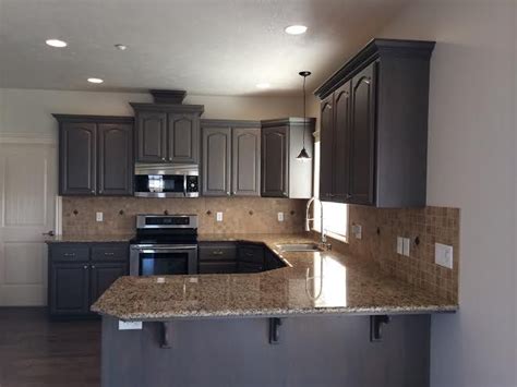 We always make sure all our customers are satisfied and we can prove it by. Refinished Kitchen cabinets to a gray stain. | Cool Home Improvements in 2019 | Stained kitchen ...
