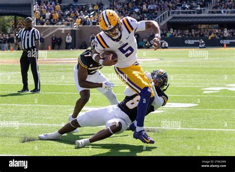 Lsu Quarterback Jayden Daniels Top Is Tackled By Missouri Linebacker Tyron Hopper Bottom