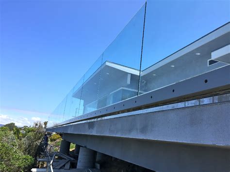 Balcony railing installers mount these balustrade systems with base shoes, against the fascia of a balcony floor, or glass adapters or floor anchors above. Contemporary Glass Balcony Railing - Patriot Glass and ...