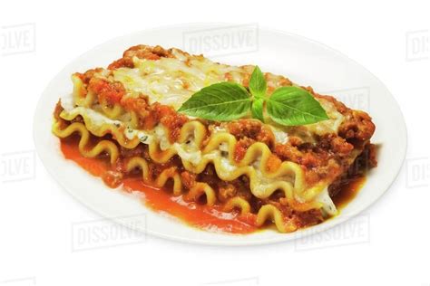 Serving Of Lasagna With Meat Sauce And Cheese White Background Stock