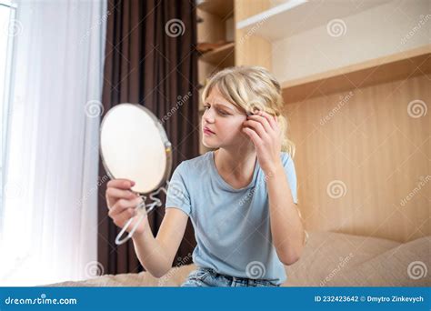 A Girl Looking At Herself And Looking Unsatisfied Stock Photo Image