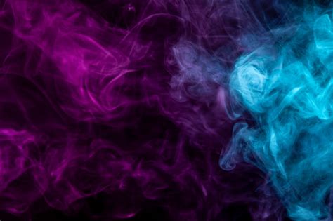 Colorful Pink And Blue Smoke On A Black Isolated Background Stock Photo