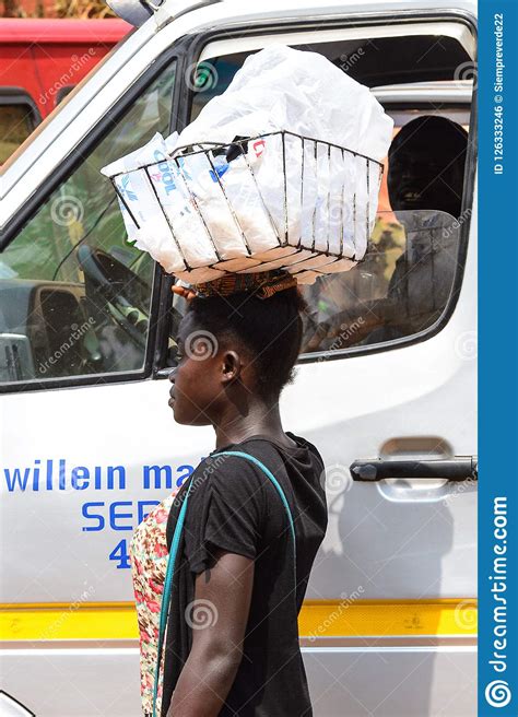 unidentified ghanaian woman carries a basket on her head in loc editorial photo image of