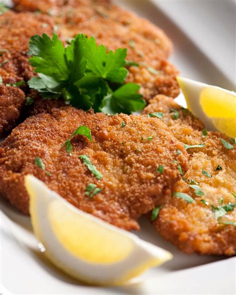 One by one put the chops into the eggs, then into the bread crumbs until all pork chops are completely covered. Wiener Schnitzel with Pork | Recipe in 2020 | Schnitzel recipes, Pork recipes, Wiener schnitzel