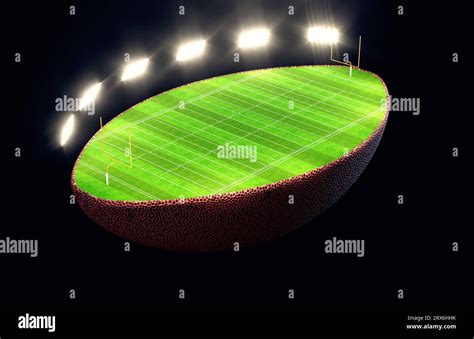 An American Football Ball Split In Half Revealing A Marked Green Grass