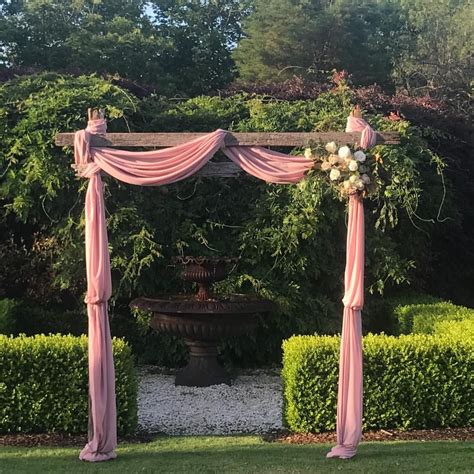 Wedding Arch With Custom Made Chiffon To Compliment The Bridesmaids By
