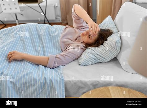 Sleepy Girl Lying In Bed At Home In Morning Stock Photo Alamy