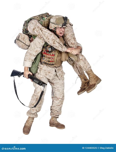 Marine Infantry Rescuing Casualty Soldier During Battle Stock Image