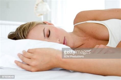 Woman Sleeping On Bed Photo Getty Images