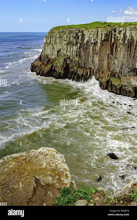 Cliff Over Ocean And Waves Stock Photo Alamy