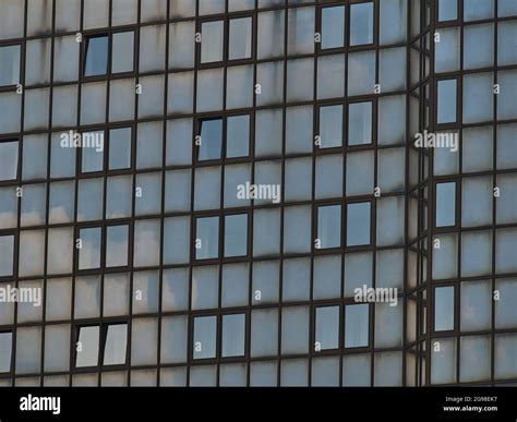 Closeup View Of The Facade Of A Commercial High Rise Building With Sky