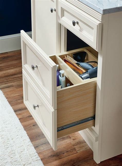 For storing towels, toilet paper and other bathroom items, consider installing a shelf, a cabinet or stacking baskets over the toilet to hold these items. #White #bathroom #cabinetry #ideas and #inspiration at # ...