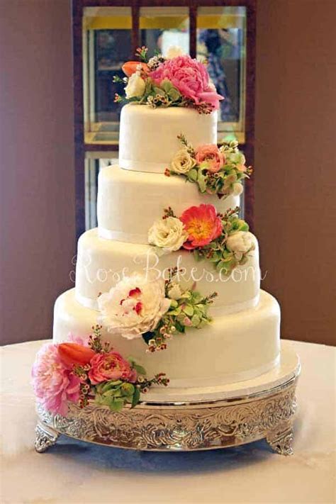 What is the best made from scratch cake recipe (vanilla flavored) that will be sturdy and easy to ice? White Wedding Cake with Cascading Fresh Flowers - Rose Bakes